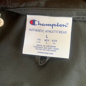 A black champion windbreaker size Large